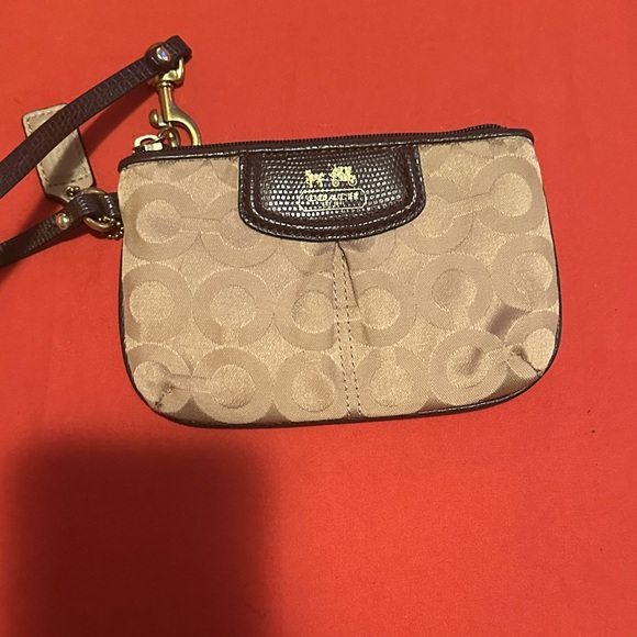 Coach Handbags - Coach Beige and Brown Wristlet. EUC.